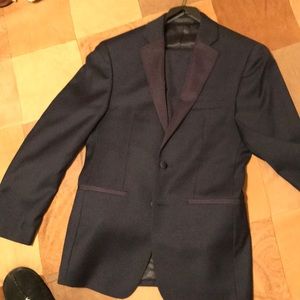 Two piece men’s navy blue suit.